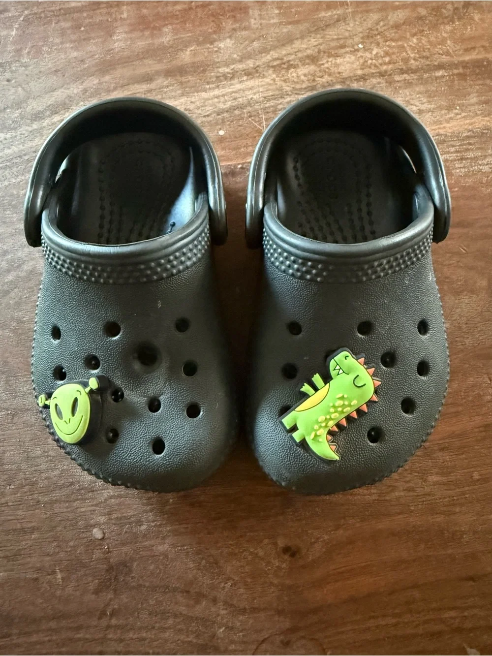 CROCS Kids Black Clogs with Green Dinosaur and Alien Charms